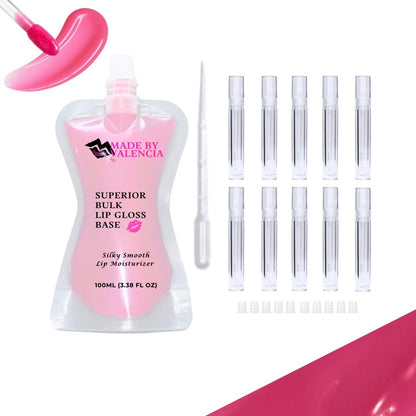 Lip gloss making kit with pink lip gloss base, multiple clear lip gloss tube containers, and stoppers