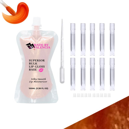 Lip gloss making kit with orange lip gloss base, multiple clear lip gloss tube containers, and stoppers