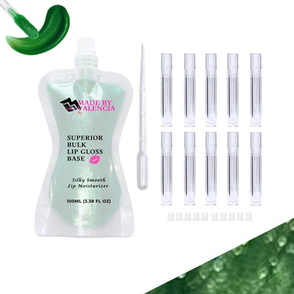 Lip gloss making kit with green lip gloss base, multiple clear lip gloss tube containers, and stoppers